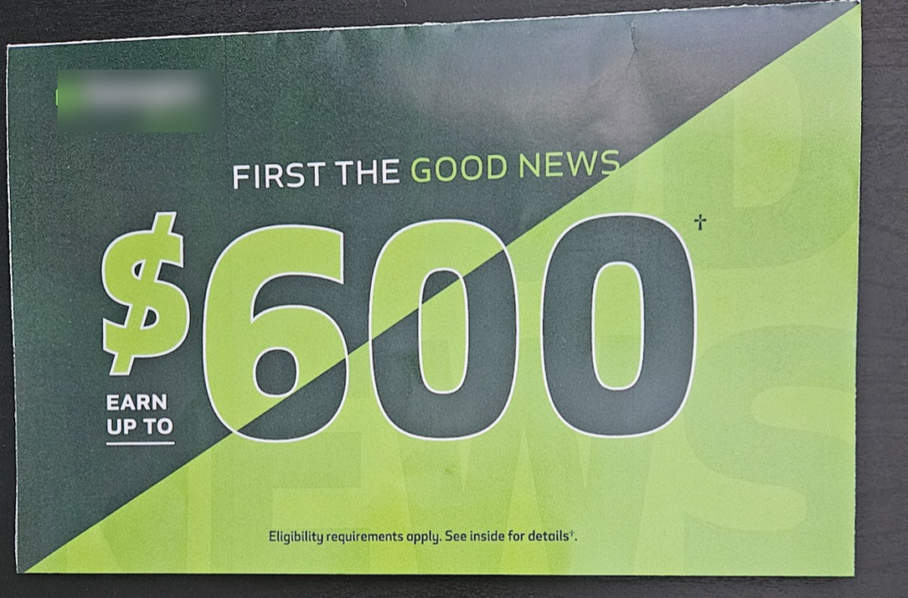 Green and black advertisment from local bank offering $600